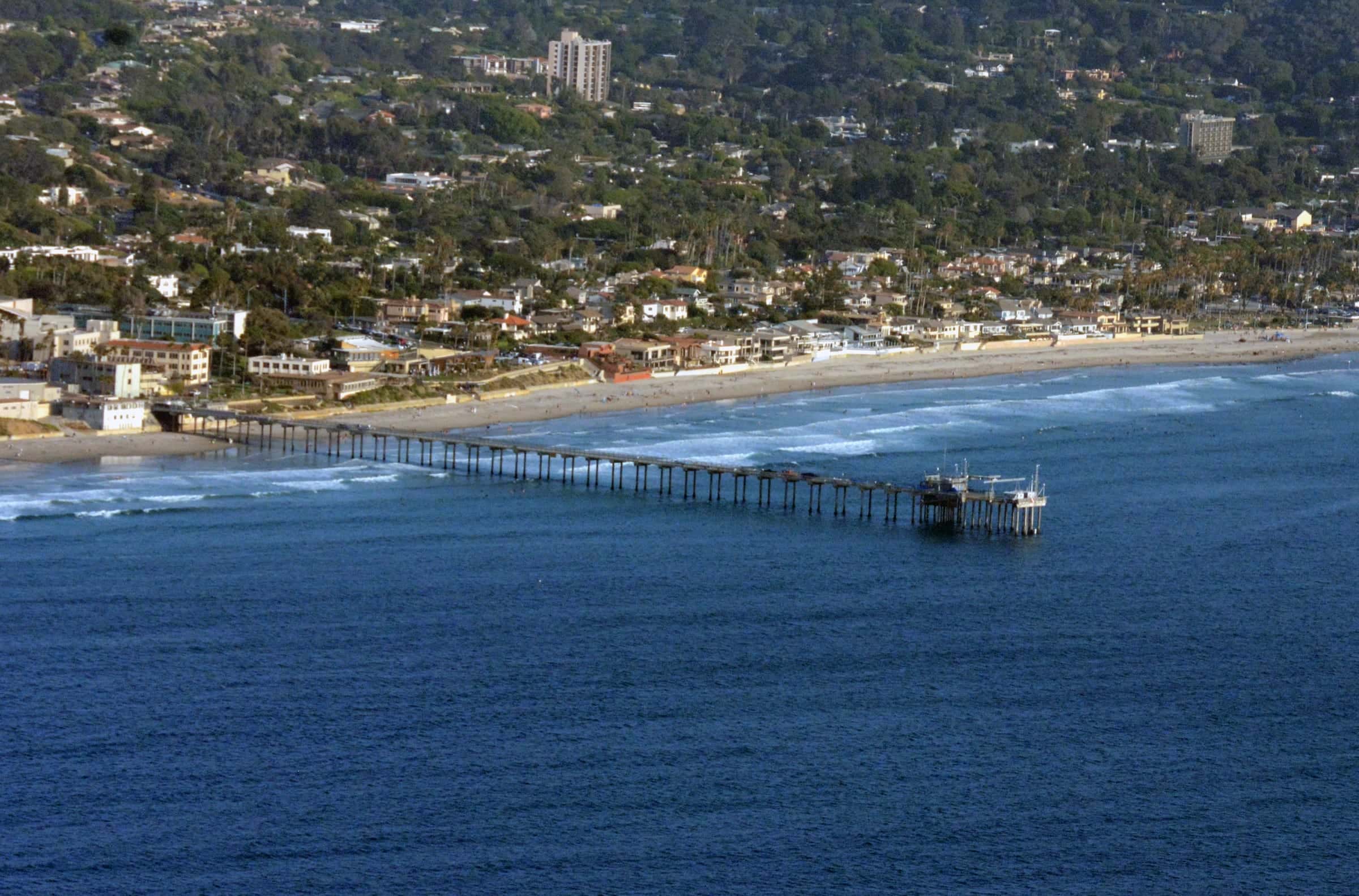 Scripps Pier and La Jolla Shores beach with homes climbing the hillside above